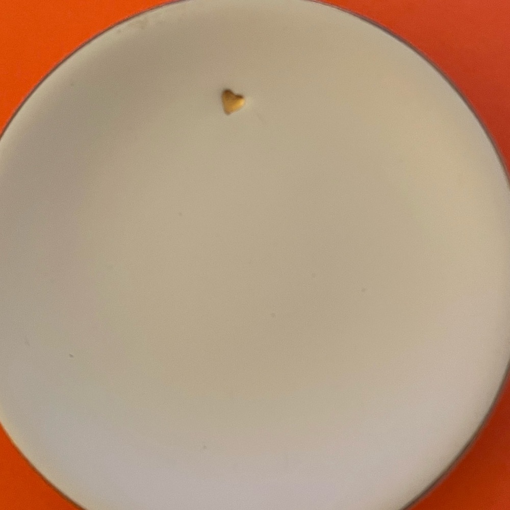 Small white ceramic plate from thirty one